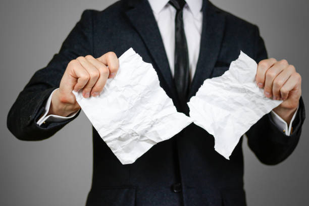 businessman-tearing-hands-crumpled-sheet