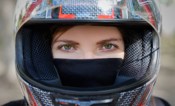 istock Young girl in a motorcycle helmet 896613830