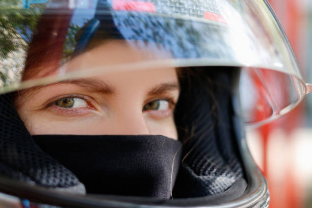 istock Young girl in a motorcycle helmet 896613842