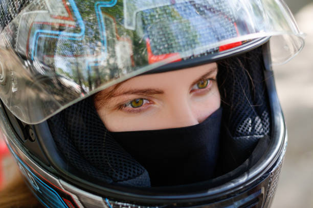 istock Young girl in a motorcycle helmet 896613848