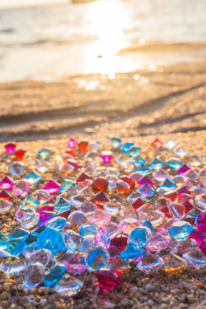 istock sun shine on diamonds on the beach 896618798