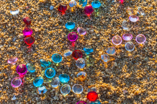 istock top view of diamonds scattered about on the beach. 896618836