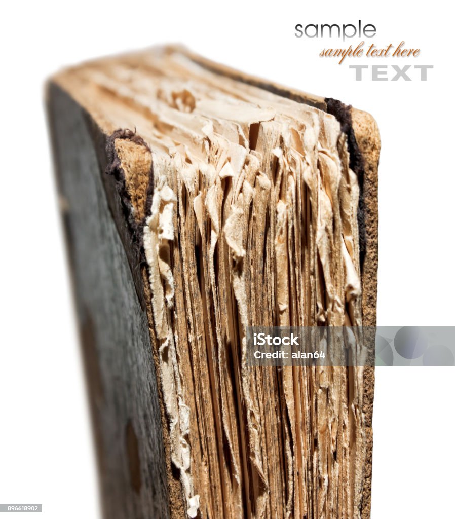 An old book with a crumpled sheet An old book with a crumpled sheet and hardcover isolated on white background Manuscript Stock Photo
