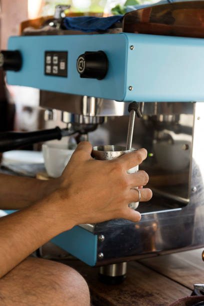 istock Hand holding pitcher to stream milk 896618928