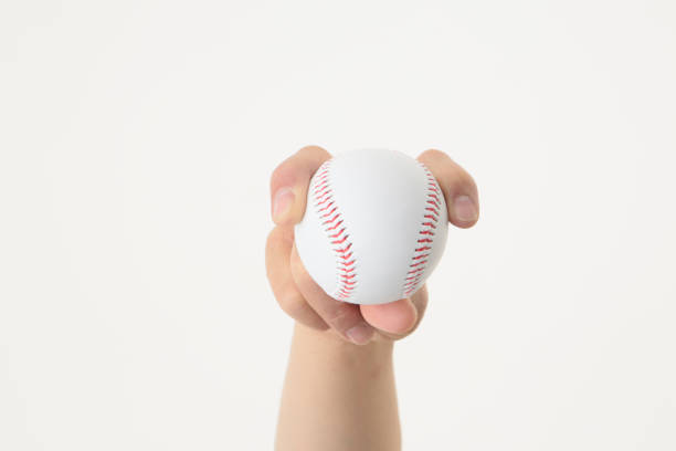istock Hand with baseball ball 896634804