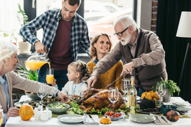 istock family celebrating thanksgiving day 896654514