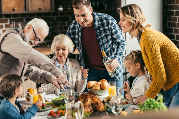 istock family having holiday dinner 896658802