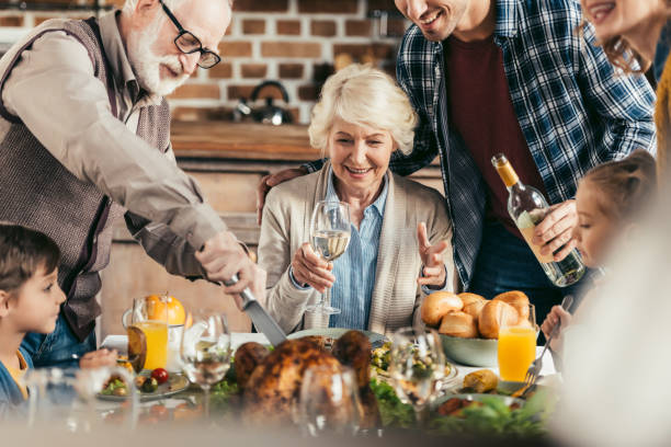 istock family having holiday dinner 896658904