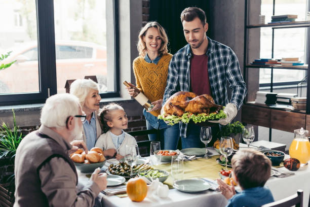 istock family having holiday dinner 896658946
