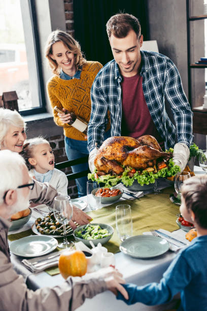 istock family having holiday dinner 896659120