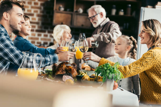 istock family having holiday dinner 896659220