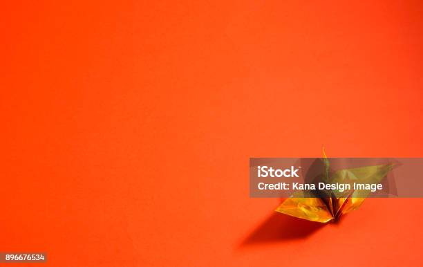 Celebration Material Of Japan Golden Foldedpaper Crane Red Background Stock Photo - Download Image Now