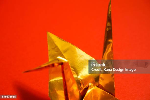 Celebration Material Of Japan Golden Foldedpaper Crane Red Background Stock Photo - Download Image Now