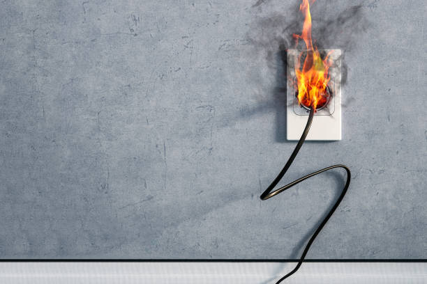 fire and smoke on electric wire plug in indoor, electric short circuit causing fire on plug socket fire and smoke on electric wire plug in indoor, electric short circuit causing fire on plug socket wired stock pictures, royalty-free photos & images