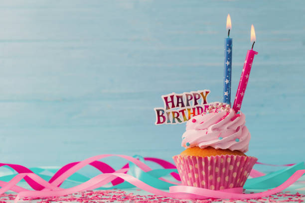 istock birthday cake on blue wooden background 896690196