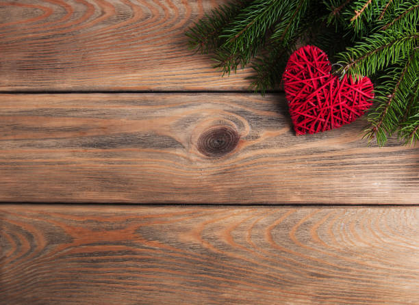 istock Christmas tree branches with heart decoration 896690558