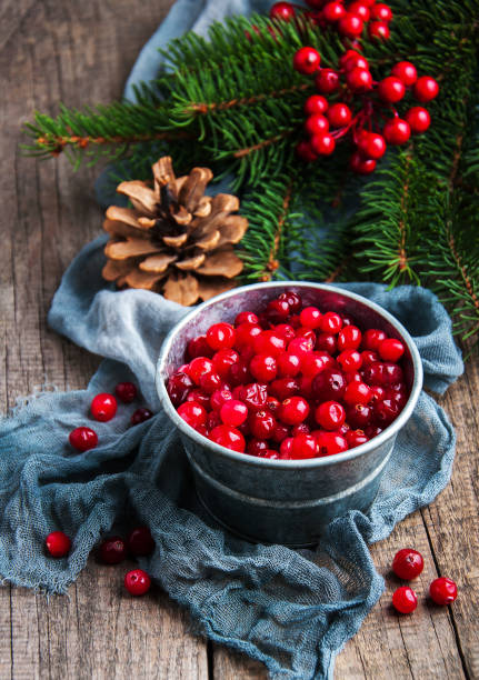 istock Red cranberries on a old wooden table 896690612