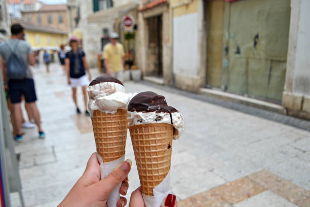 istock Chocolate ice creams holding in the hands 896697964