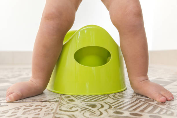 istock Crop the children's legs over the chamberpot 896704794