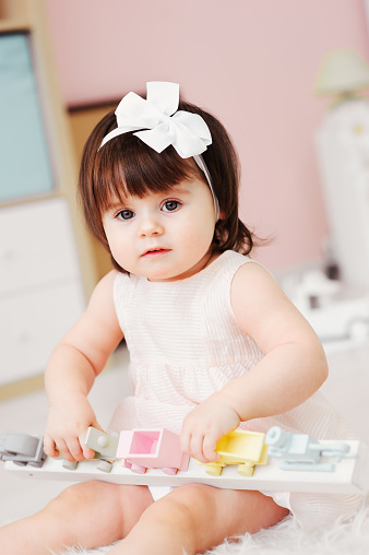 Cute Happy 1 Year Old Baby Girl Playing With Wooden Toys At Home Modern Nursery Interior Early Learning Concept Stock Photo - Download Image Now - iStock Cute Happy 1 Year Old Baby Girl Playing With Wooden Toys At Home Modern Nursery Interior Early Learning Concept Stock Photo - Download Image Now - iStock