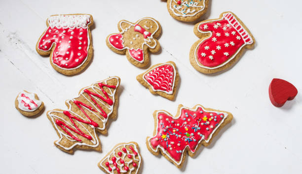 istock Christmas gingerbread cookies on white wood table 896709784