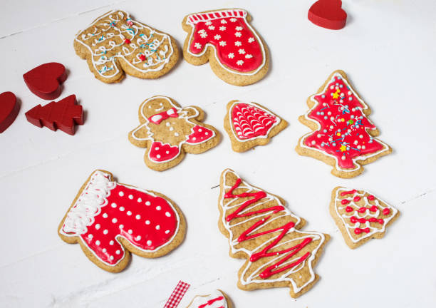 istock Christmas gingerbread cookies on white wood table 896709830