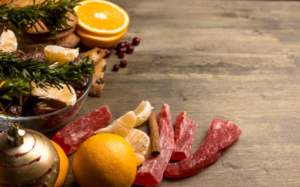 istock Tea with orange, oranges, dates, cinnamon, dried popaya, cranberries on the background 896723912