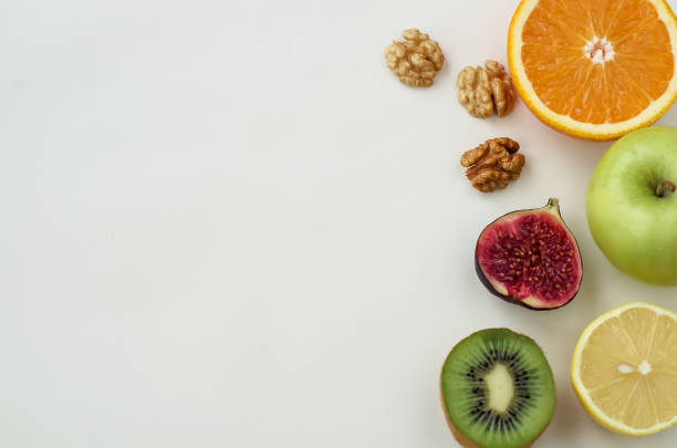 istock Background of fresh sliced fruit on a table in the afterno 896726306