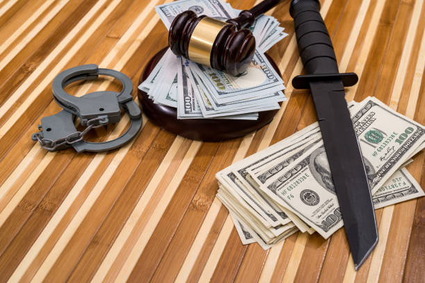 istock handcuffs,  dollar, hammer judge and knife. 896726756