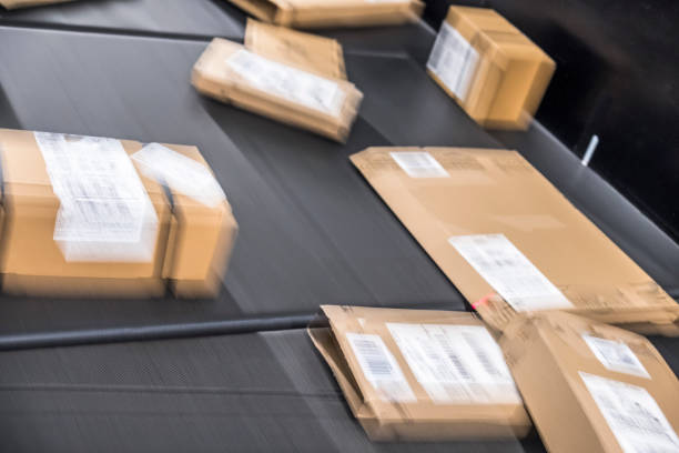 istock Huge amount of parcels on conveyor 896727012