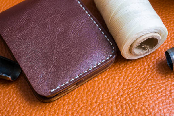 istock Handmade of genuine leather wallet bifold on craftsmanship tool 896734066