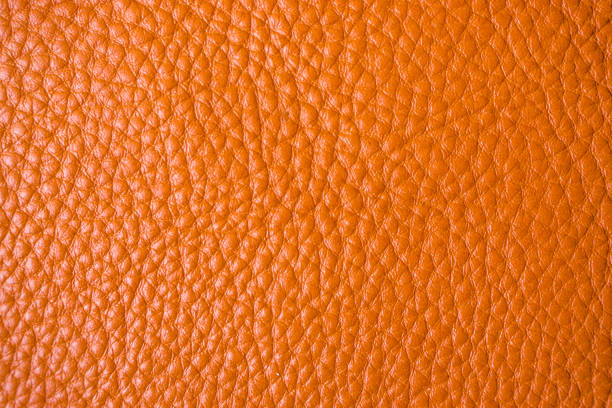 istock Genuine full grain leather tan color colose up background 896734266