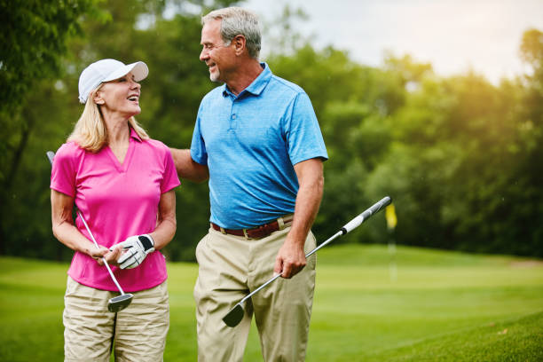 istock Together we improve each others golf skills 896734960