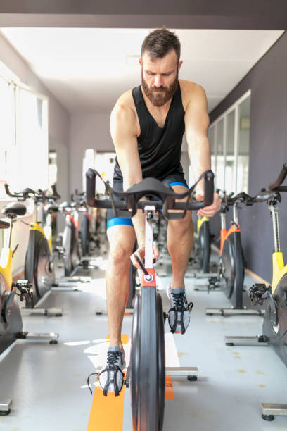 istock Cycling on spining mahine in gym 896737748