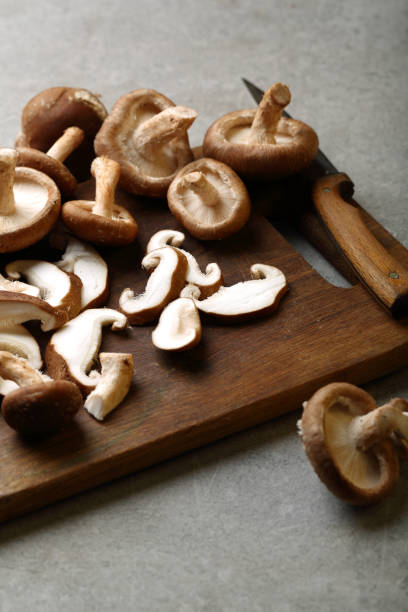 istock Cutting shiitake mushrooms on wood, cooking 896737762