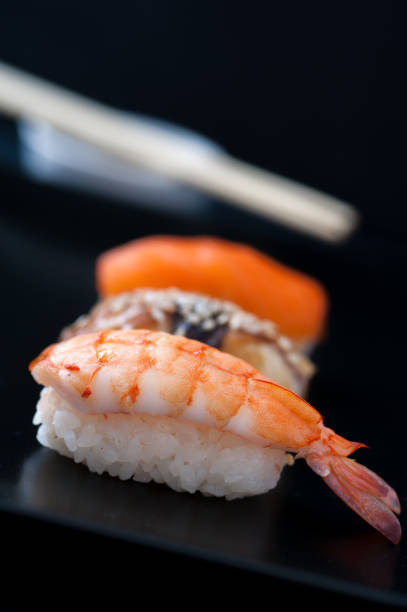 istock Sashimi sushi set on black plate, closeup. 896738806
