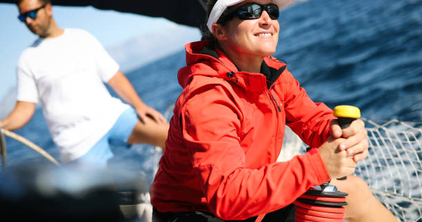 istock Attractive strong woman sailing with her boat 896742424
