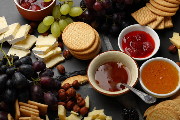 istock Fruits and cheese snack on slate, food closeup 896746404