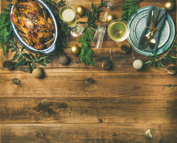 istock Christmas or New Year celebration table setting over wooden background 896752186