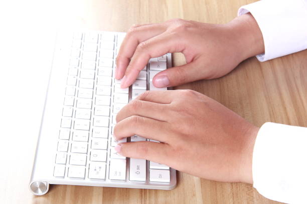 istock Female hand typing with keyboard 896752678