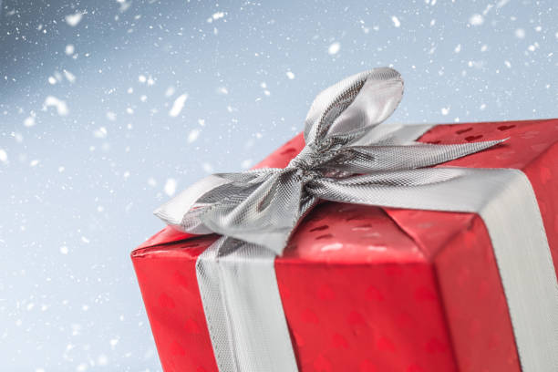 istock Christmas valentine or birthday red gift box with silver ribbon 896755348