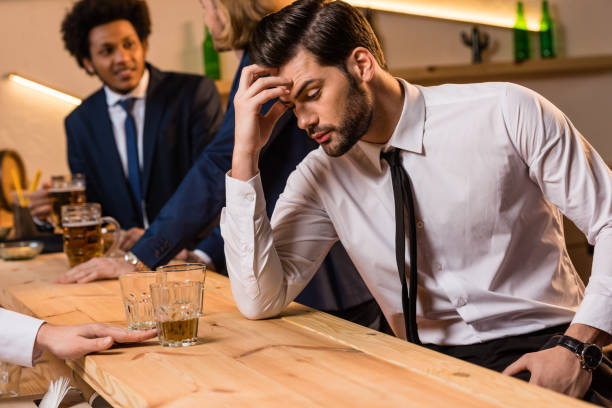istock drunk businessman in bar 896761402