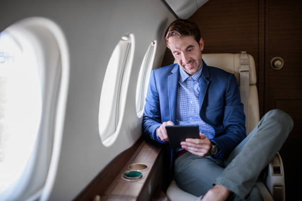 istock Man in private jet airplane 896764354