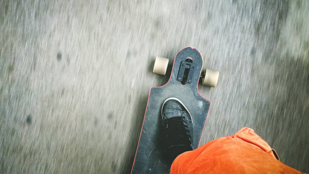 istock Longboarder driving on the street 896764988