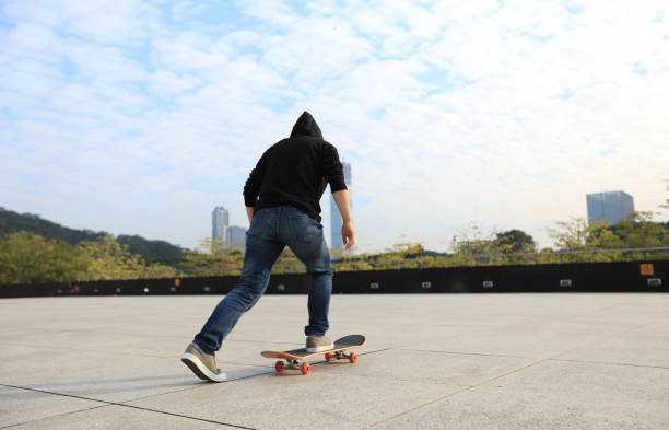 female skateboarder riding with skateboard on city