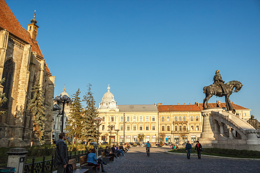 CLUJ-NAPOCA, ROMANIA - October 19, 2014: Unirii Square and The St. Michael's Church in Cluj-Napoca, Romania