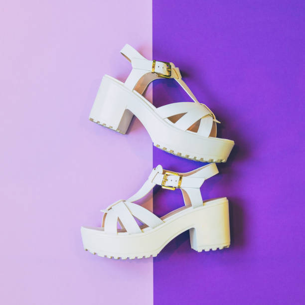 fashionable white platform sandals stock photo