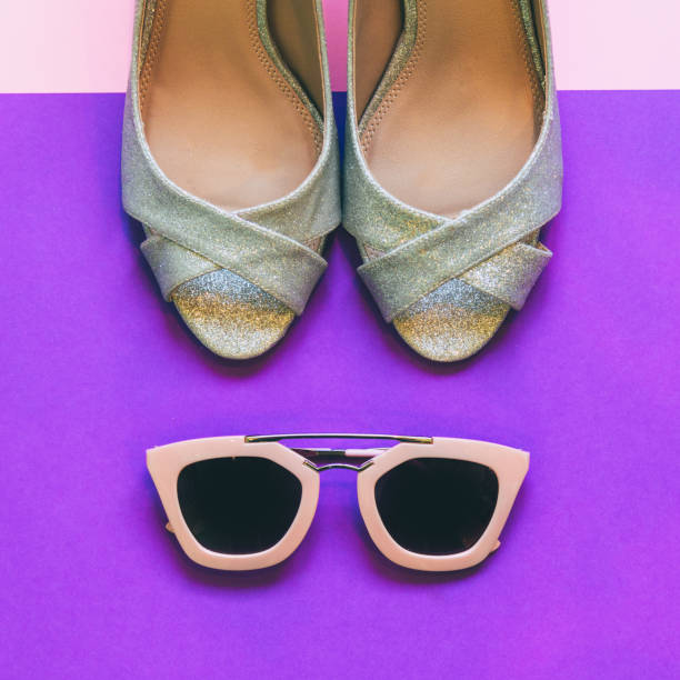 istock sunglasses and womens silver sparkle high heel shoes 896768248