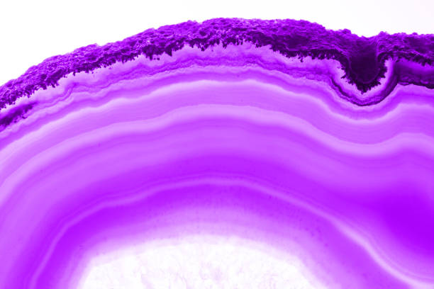 Ultra violet pruple agate mineral cross section isolated on white background. Abstract background