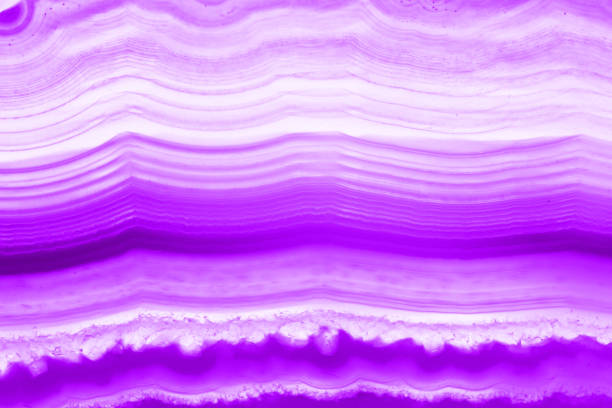 istock Ultra violet pruple agate mineral cross section isolated on white background. Abstract background 896768562